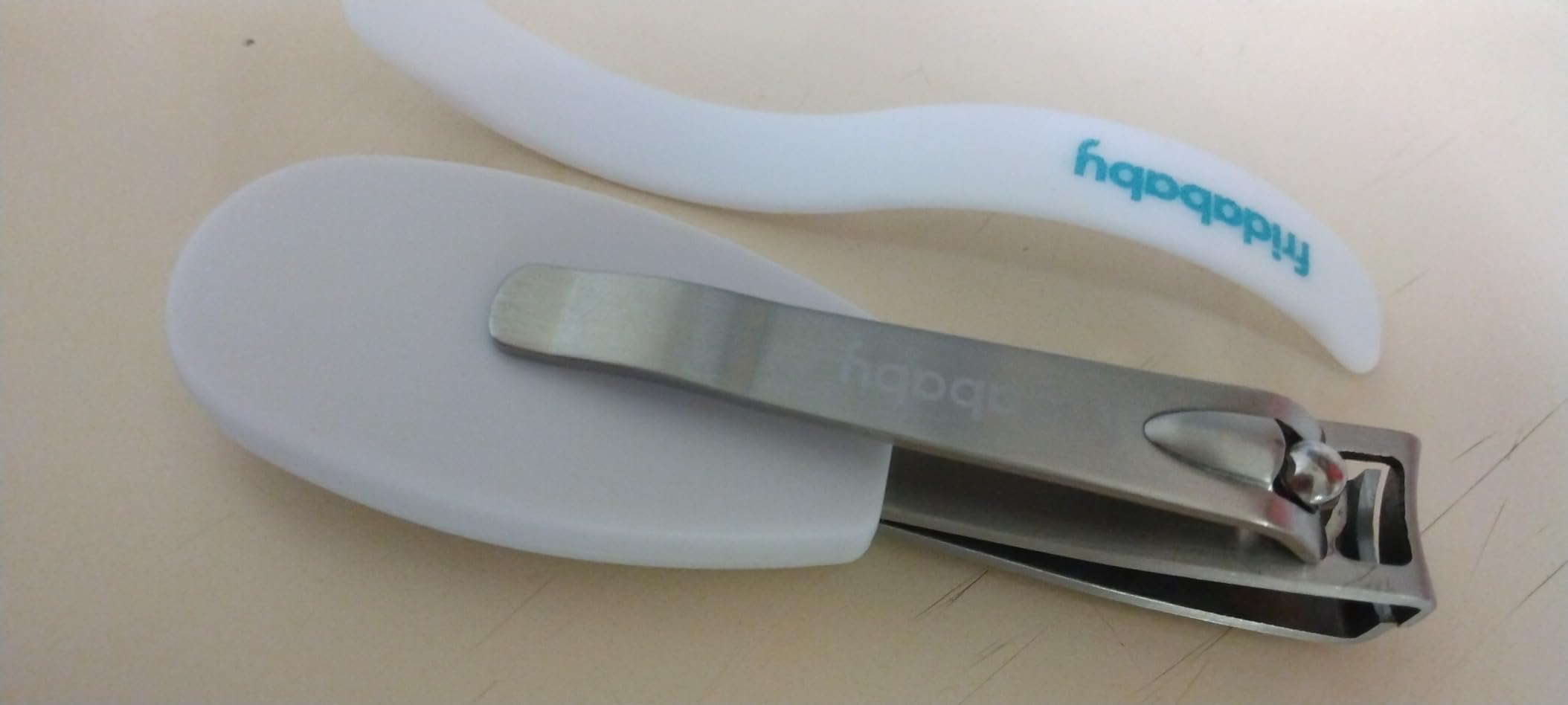 Frida Baby NailFrida Baby Nail Clippers & Nail File & Buffer for Newborns and Up, Safety Spyhole, Nickel Free, Curved Clipper to Fit Babies Nails customer photo 2