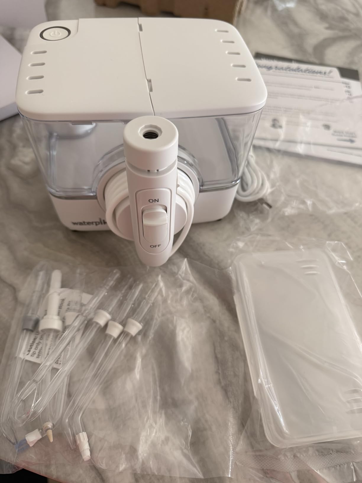 Waterpik ION Professional Water Flosser, Rechargeable and Portable for Teeth, Gums, Braces, 10 Settings, 7 Flossing Tips For Multiple Users And Needs, ADA Accepted, WF-12 White customer photo 1