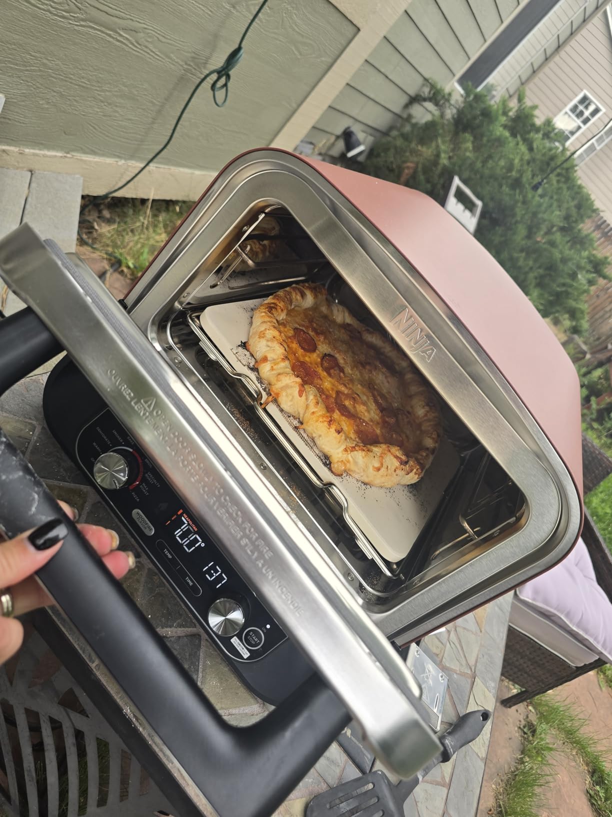 Ninja Woodfire Outdoor Pizza Oven, 8-in-1 Portable Electric Roaster Oven, Heats up to 700F, 5 Artisan Pizza Settings, Integrated BBQ Smoker Box, Includes Flavored Wood Pellets, Terracotta Red customer photo 1