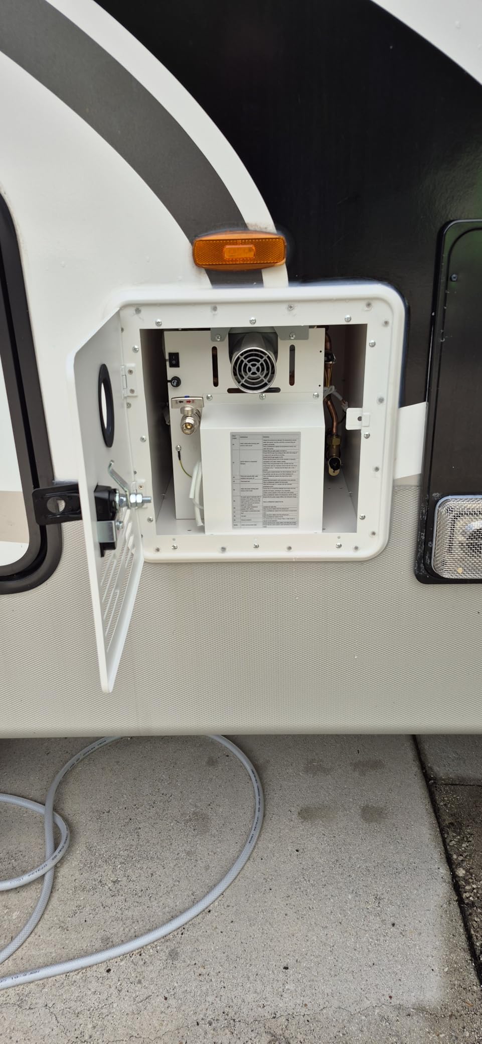 RV water heater, 11Gen 65000 BTU Tankless Water Heater, with 15 x 15 inches Door, 12v DC, High Altitude Available RV Instant Propane Hot Water Heater with showerhead (White) customer photo 1