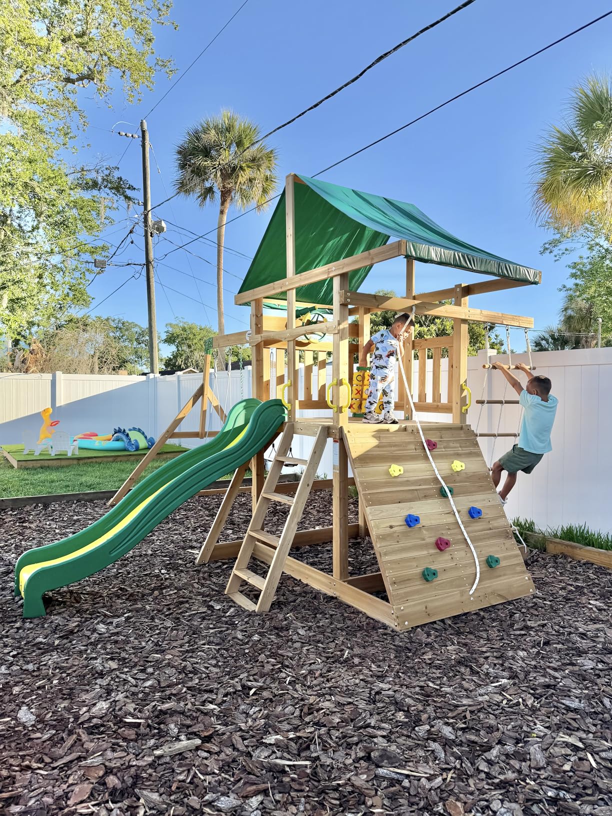 Backyard Discovery Mount Mckinley Cedar Wood Swing Set with Wave Slide, Play Deck, Double Rock Wall, Rope Ladder, Web Swing, Belt Swings, Toy Telescope, Steering Wheel, Sandbox Area, Outdoor Playset customer photo 1