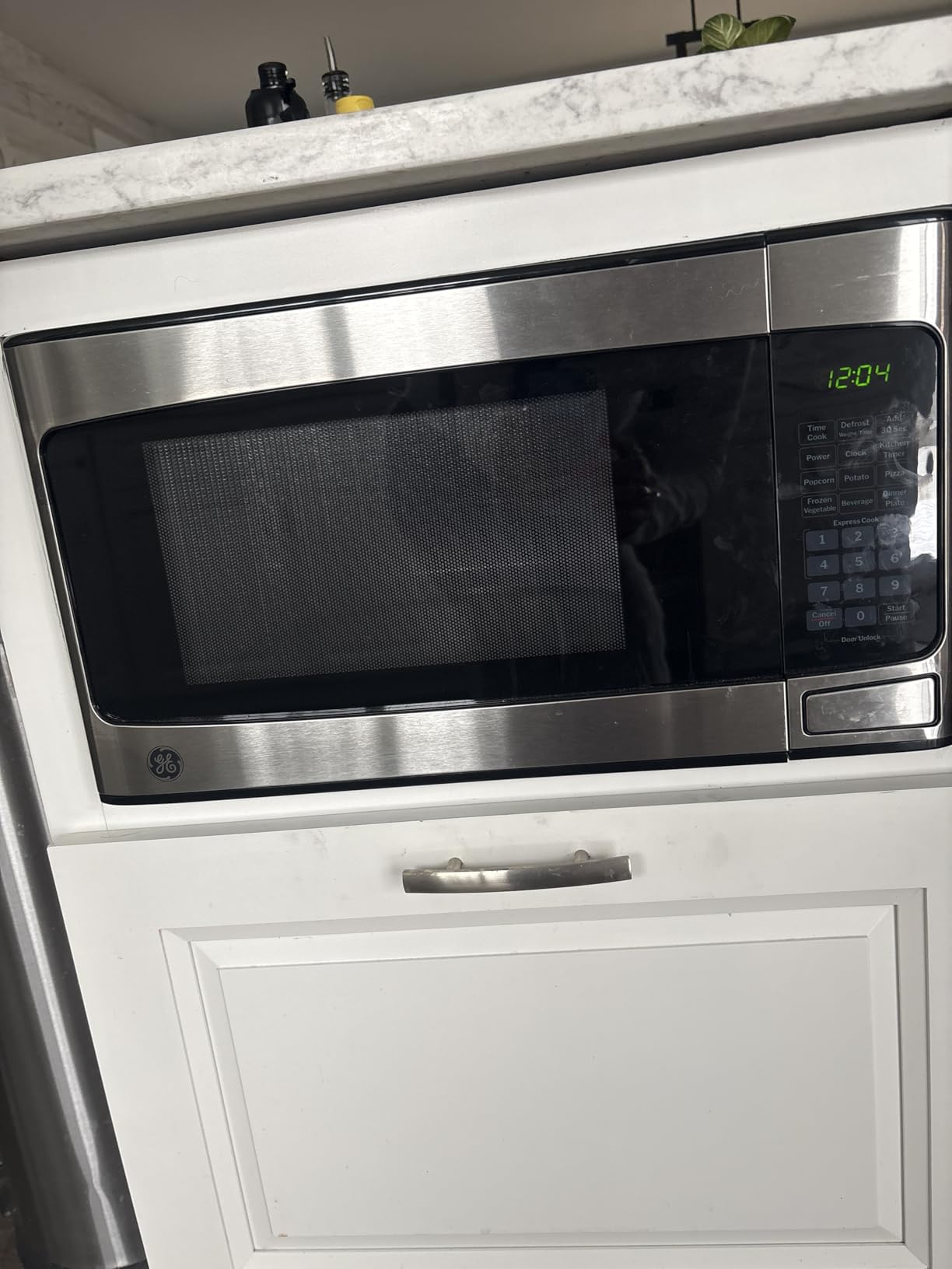 GE Countertop Microwave Oven, Compact 1.1 Cubic Ft., 950-watt Capacity, 6 Auto Cooking Settings, Child-Lock Technology, Kitchen Essentials for The Countertop, Dorm Room or Apartment, Stainless Steel customer photo 1