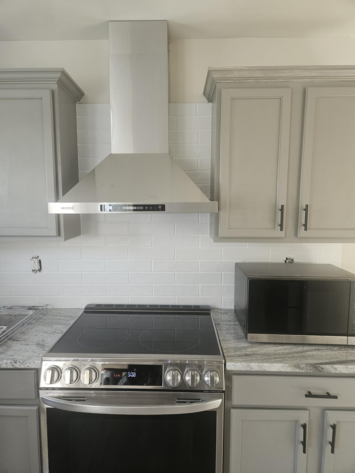 IKTCH 30-inch Wall Mount Range Hood 900 CFM Ducted/Ductless Convertible, Kitchen Chimney Vent Stainless Steel with Gesture Sensing & Touch Control Switch Panel, 2 Pcs Adjustable Lights(IKP02-30'') customer photo 2