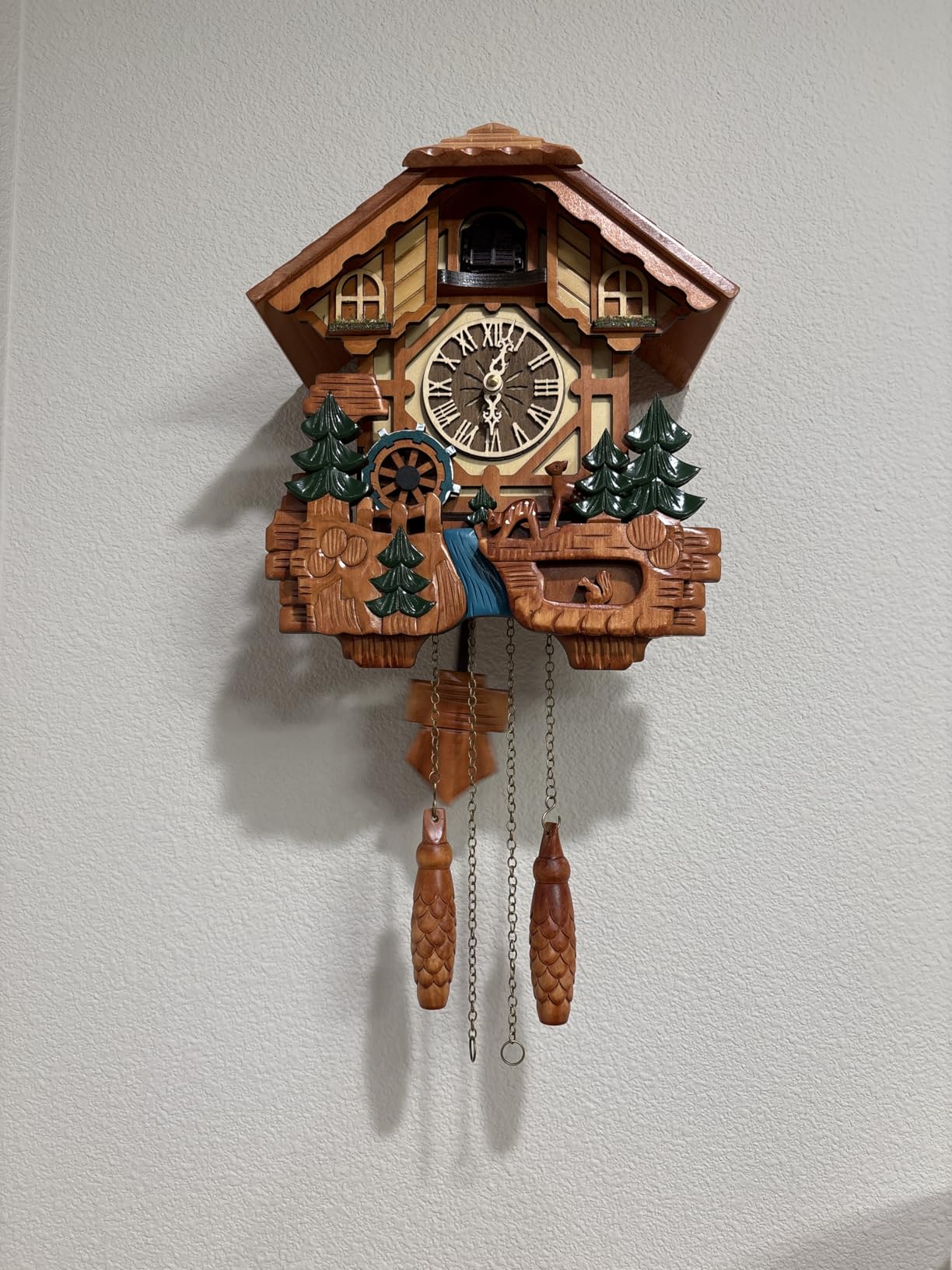 Kintrot Cuckoo Clock Black Forest Chalet Clock 11x22.5 Inches | Handcrafted Wooden Wall Clock with Singing Bird, Rotating Waterwheel, Night Mode and 12 Melodies customer photo 1