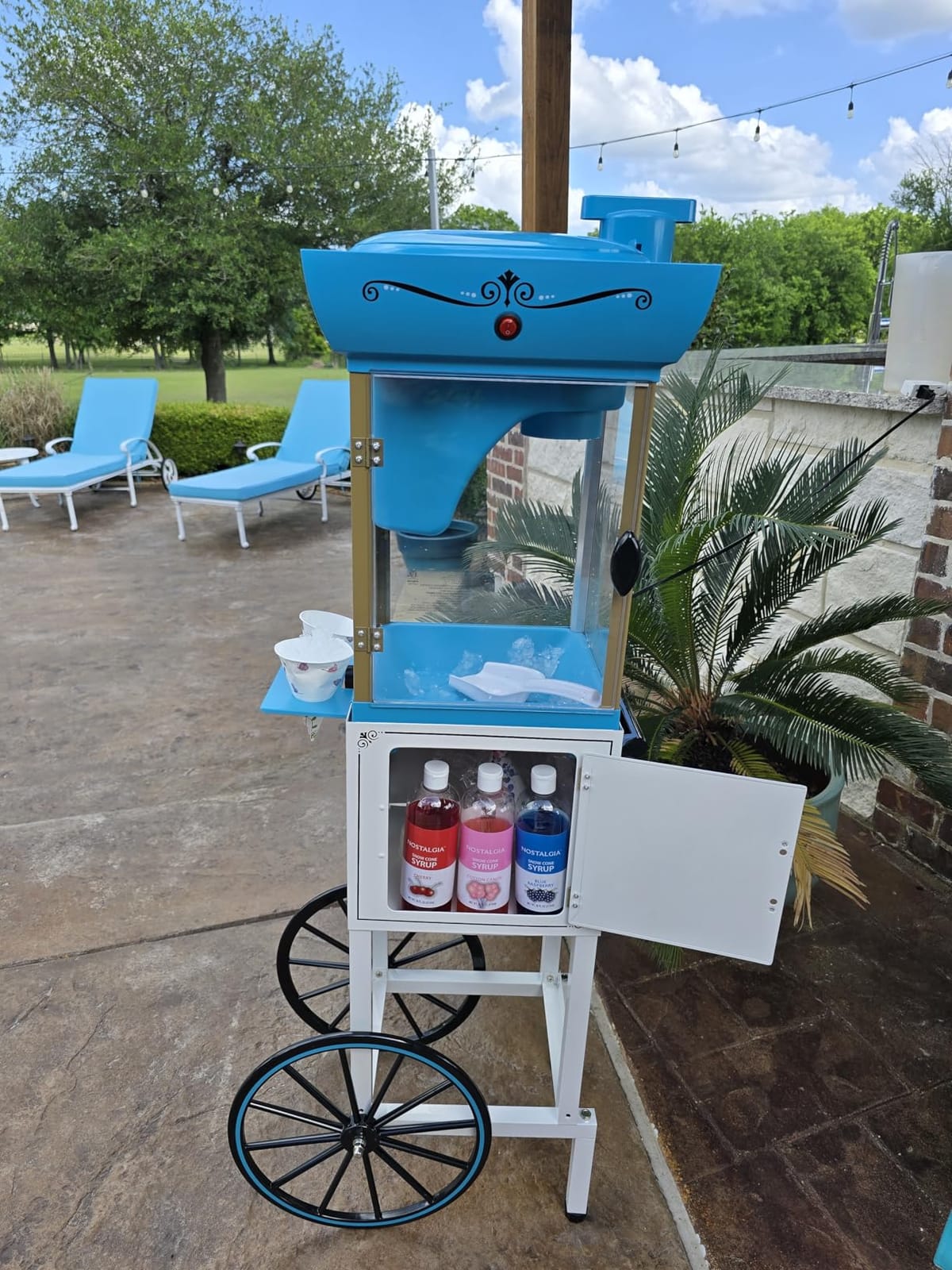 Nostalgia Snow Cone Shaved Ice Machine - Retro Cart Slushie Machine Makes 48 Icy Treats - Includes Metal Scoop, Storage Compartment, Wheels for Easy Mobility - White, Blue customer photo 2