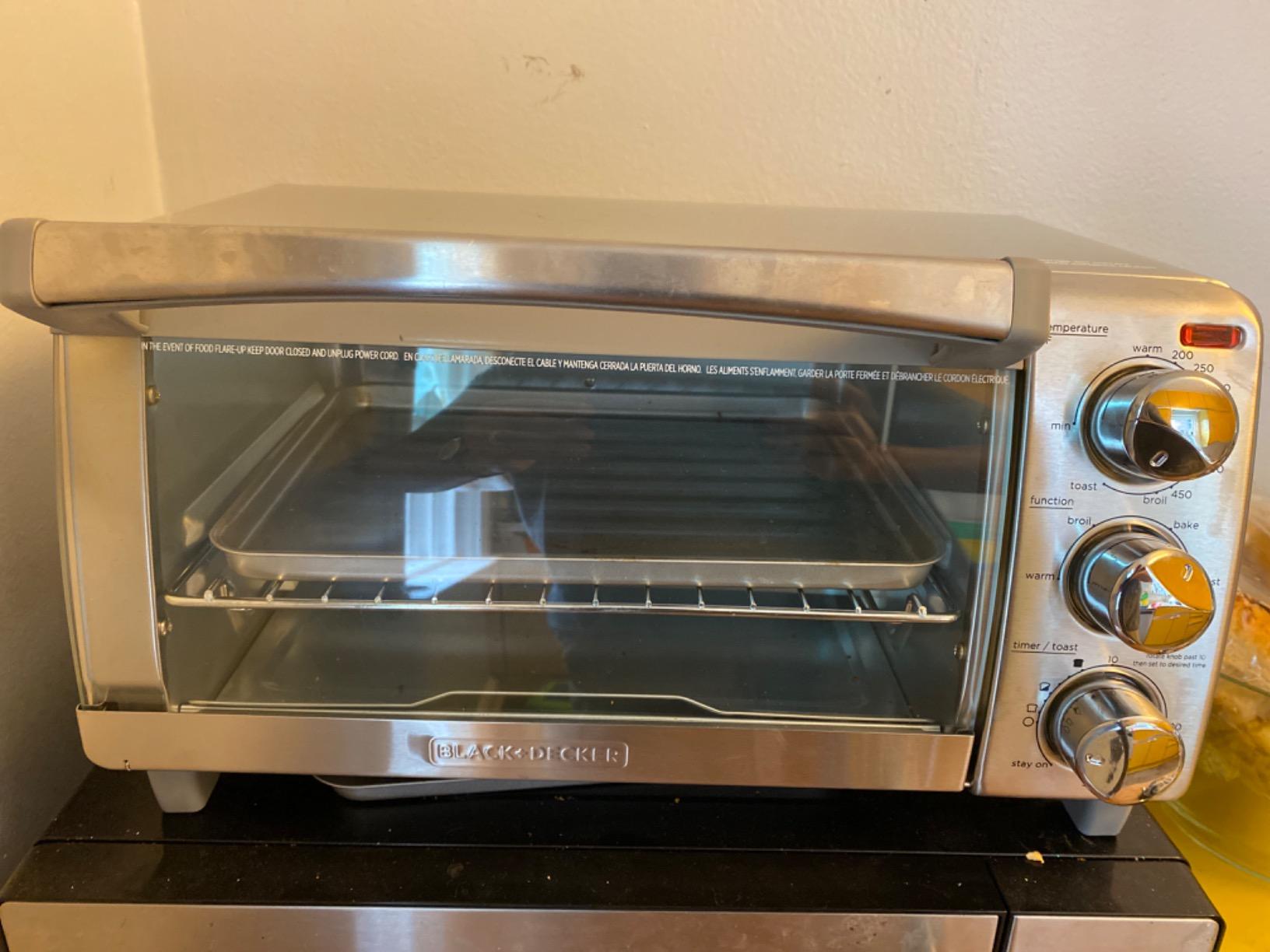 BLACK+DECKER 4-Slice Toaster Oven with Natural Convection, Stainless Steel, TO1760SS (TO1760SST-1) | Natural convection toaster oven fits 4 slices with 30-minute timer, bake pan and even cooking performance. customer photo 1